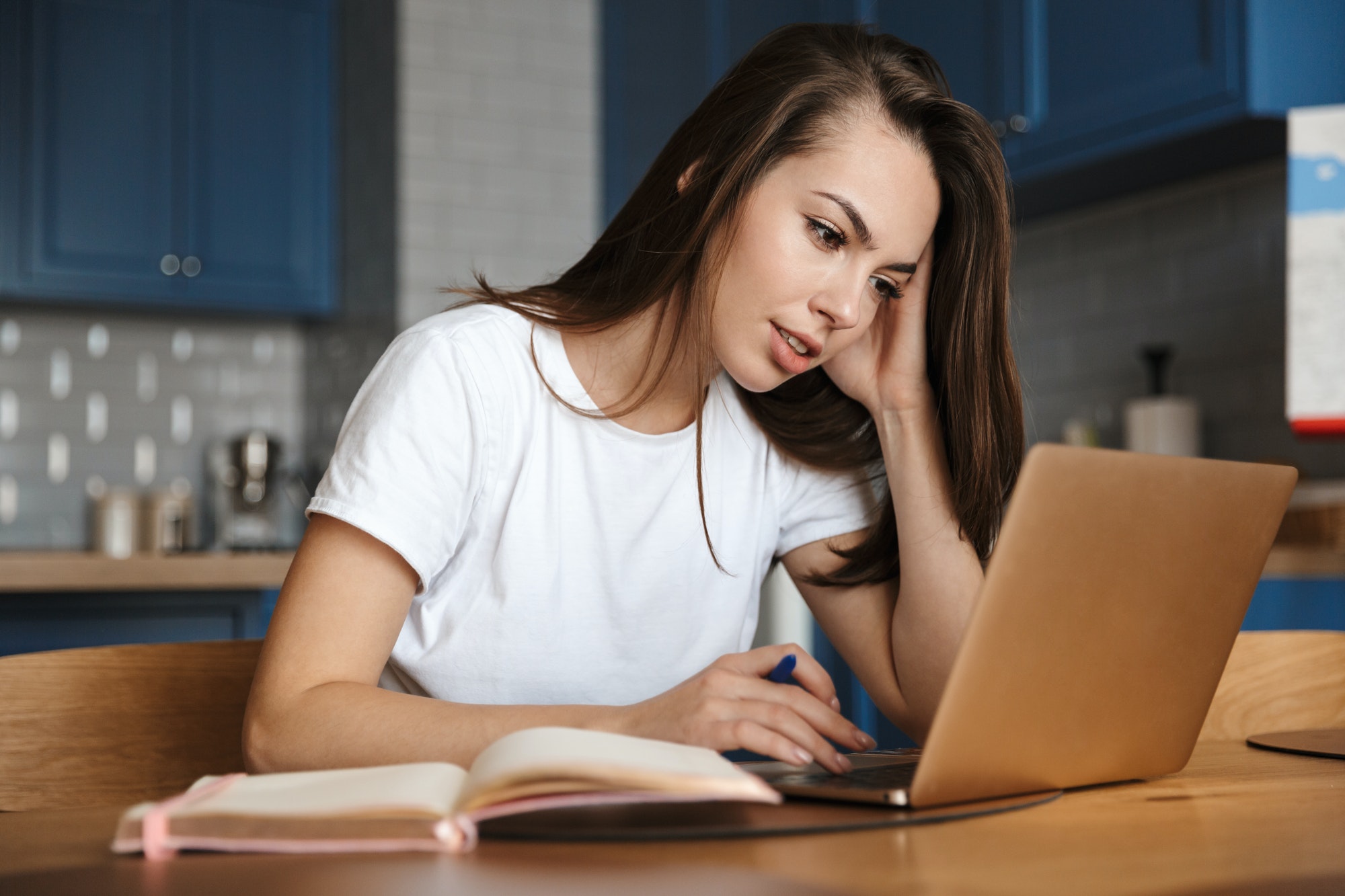 Concentrated woman using laptop