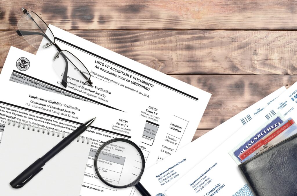 USCIS form I-9 Employment eligibility verification lies on flat lay office table and ready to fill