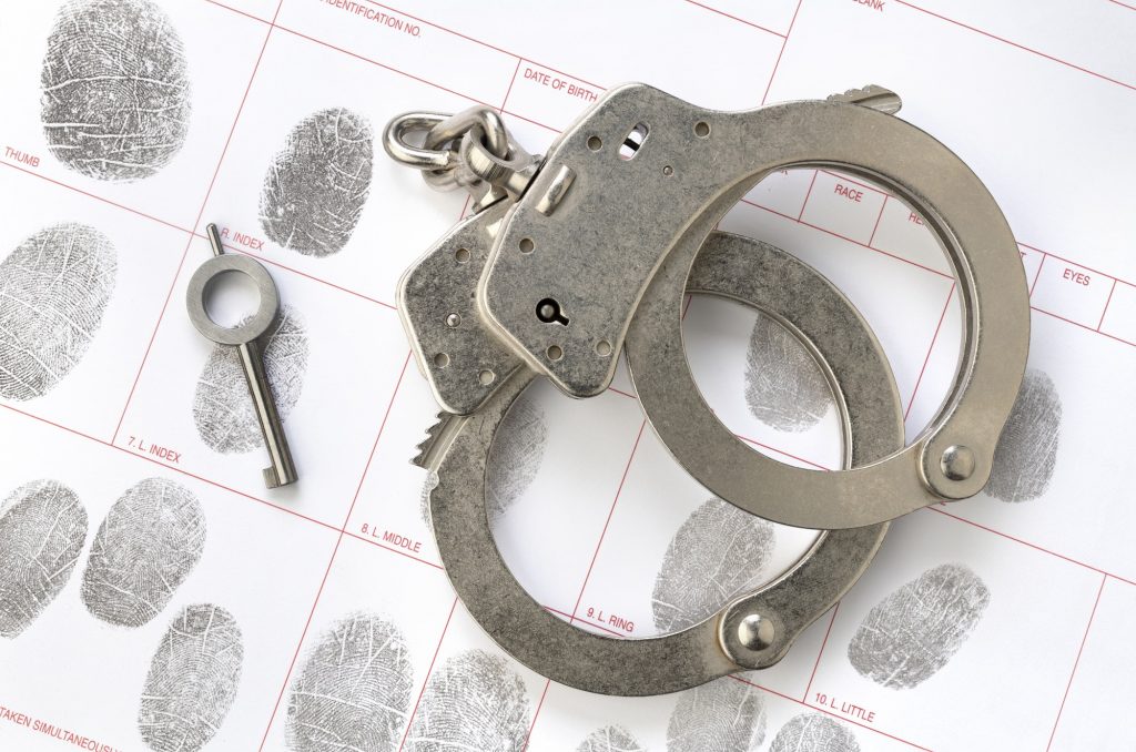 Handcuffs on fingerprint sheet